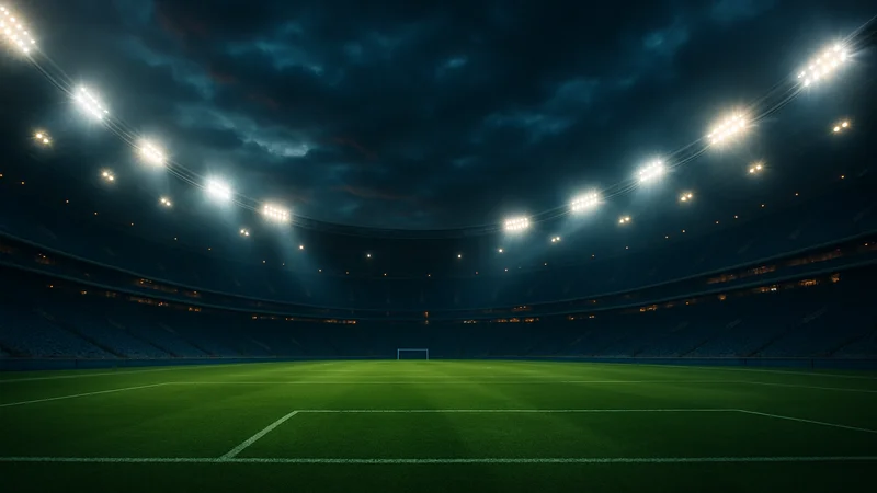 Football stadium under floodlights at night